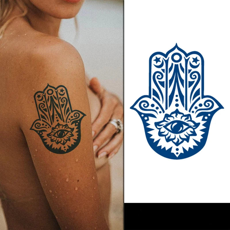 Hamsa hand tattoo on a person's arm with a blue Hamsa hand design