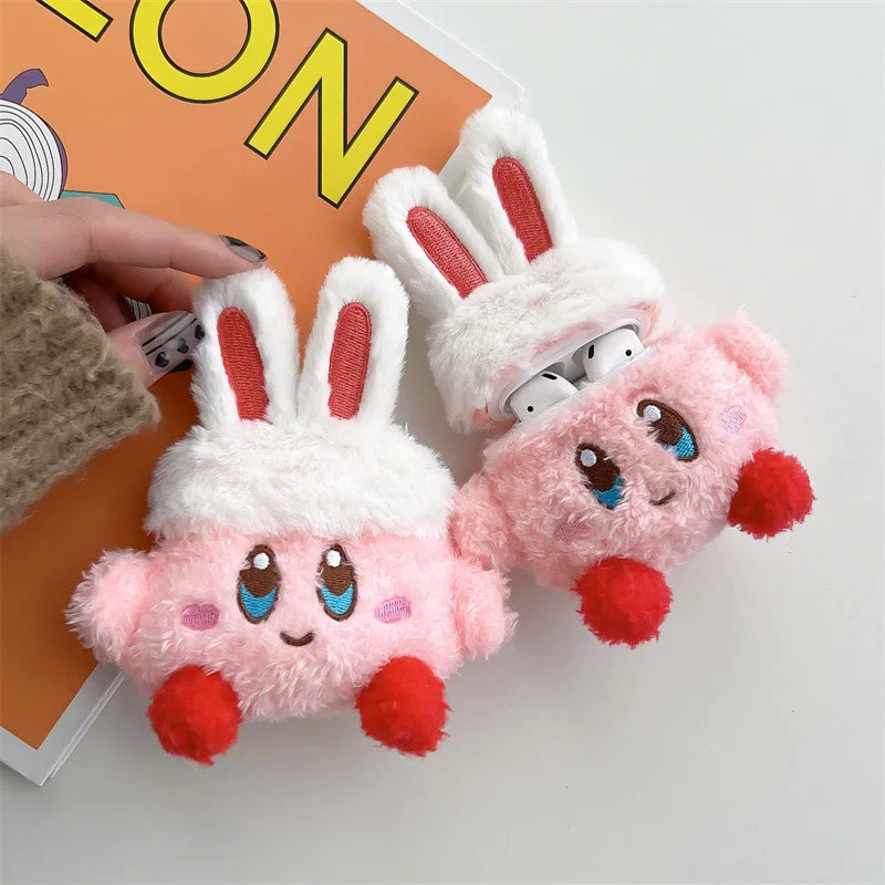 Two plush toys resembling cartoon characters with red accents on a white background.