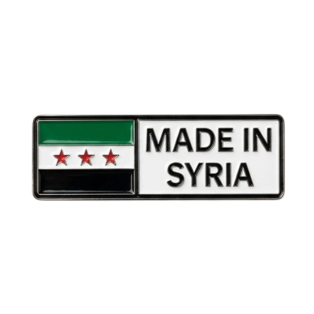 Flag of Syria with 'Made in Syria' text on a white background