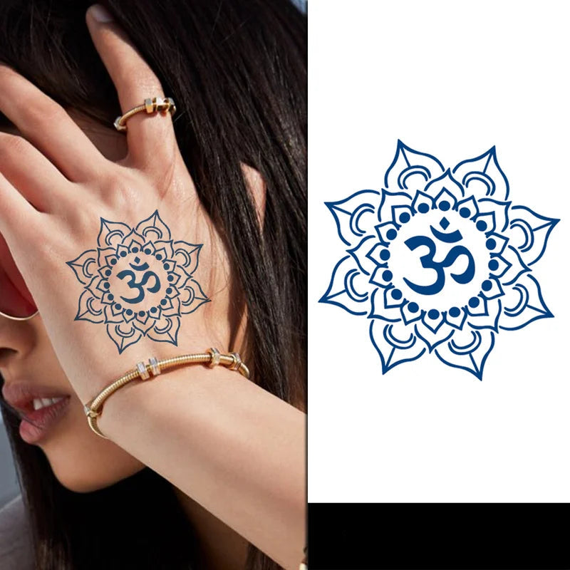 Mandala tattoo with Om symbol on a hand