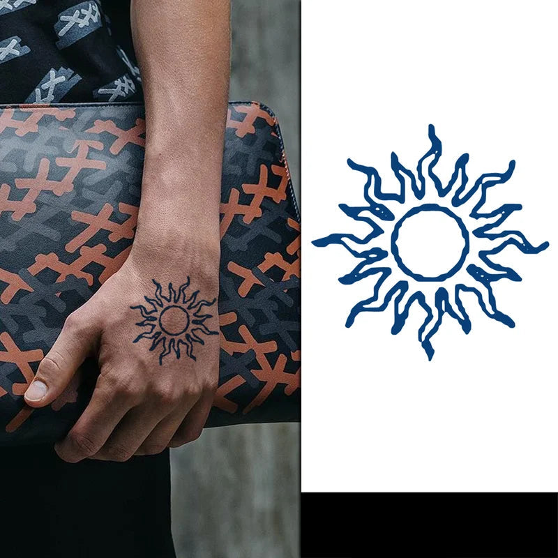 Sun jagua tattoo on a persons hand holding a purse