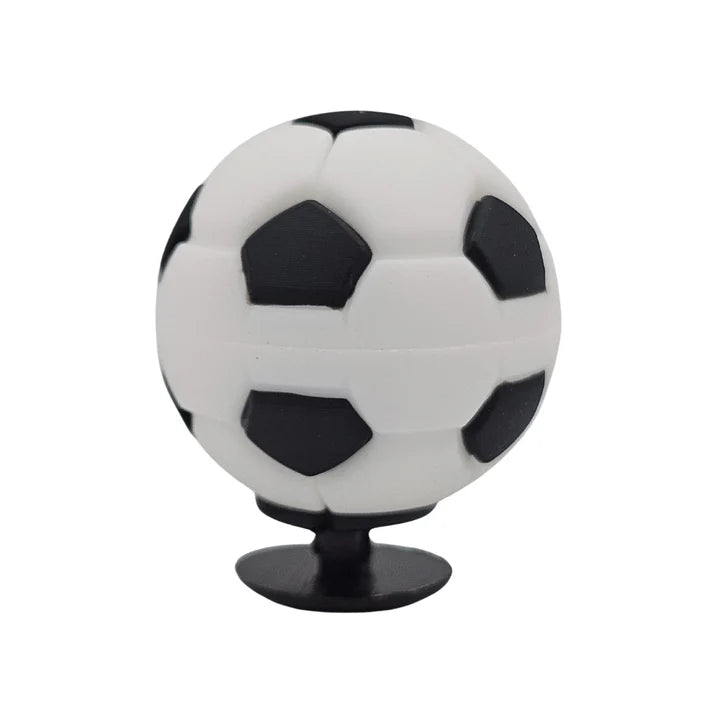 Soccer ball-shaped phone stand on a white background