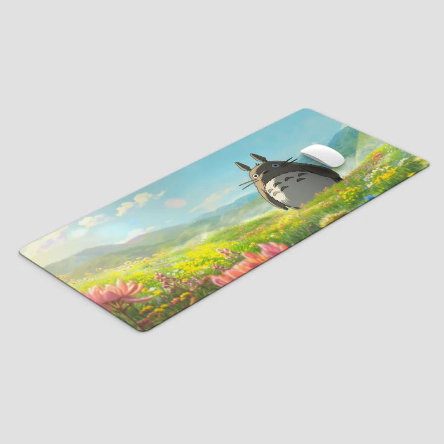 Yoga mat with Totoro design on a grassy field