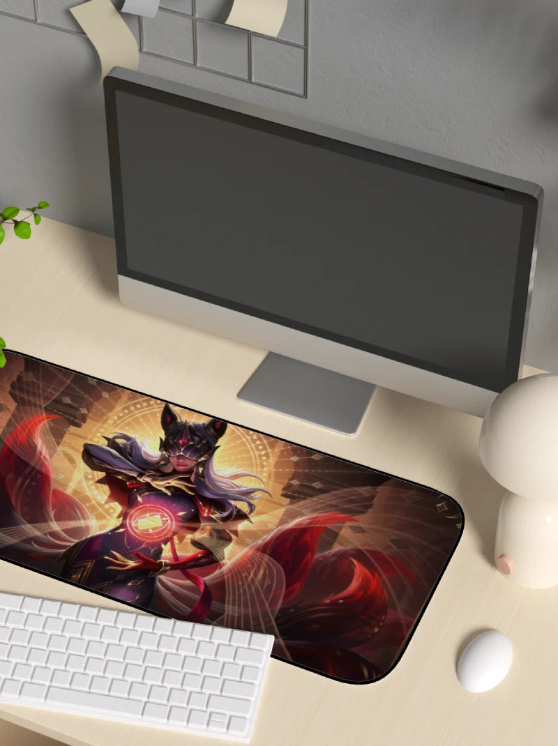 Desk setup with a large mouse pad featuring league of legends character ahri arcana design, keyboard, and monitor.