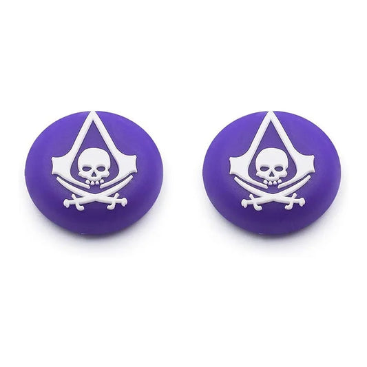 Two purple buttons with white skull and crossbones design on a white background