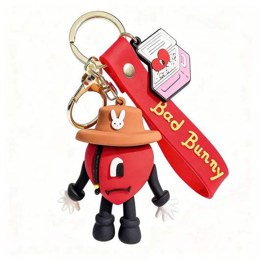 Red character keychain with a hat and 'Bad Bunny' strap on a white background