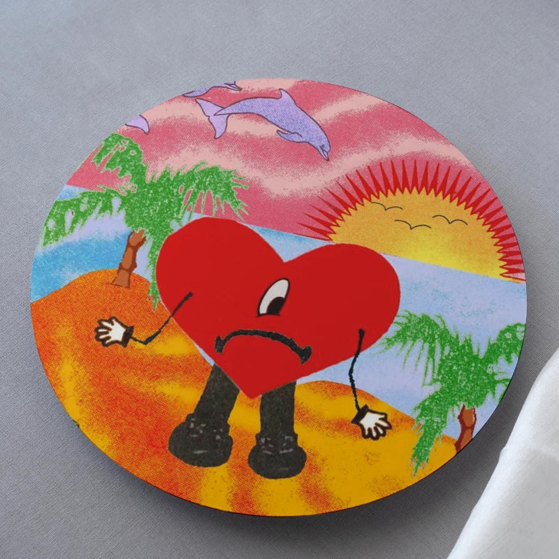 Colorful illustration of a heart character with a beach background on a gray surface