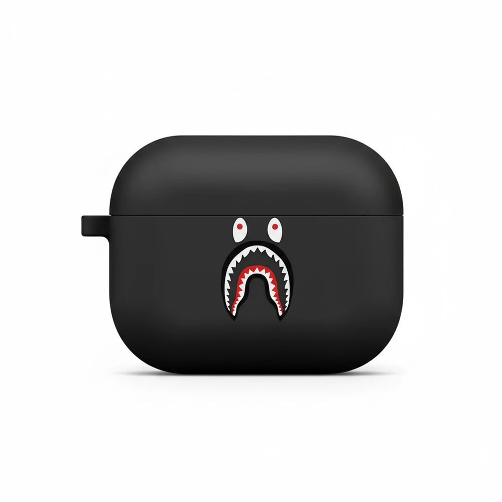 Black airpod case with a shark mouth design on a white background