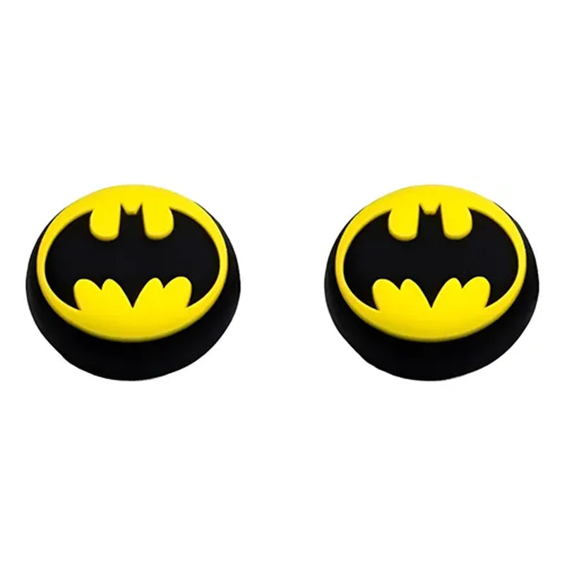 Two Batman logo earrings on a white background