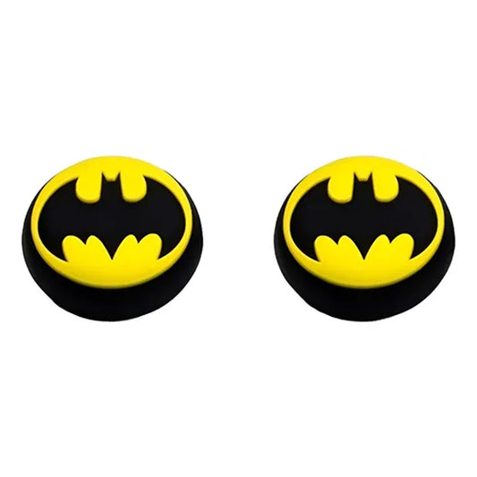 Two Batman logo earrings on a white background