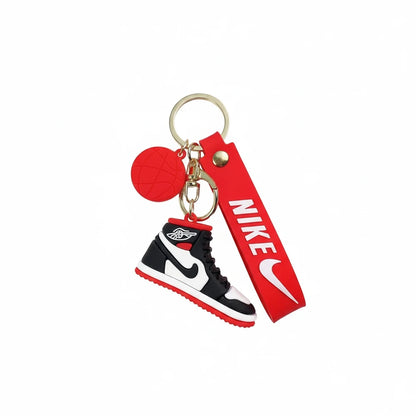 Keychain with Nike logo and shoe design on a white background