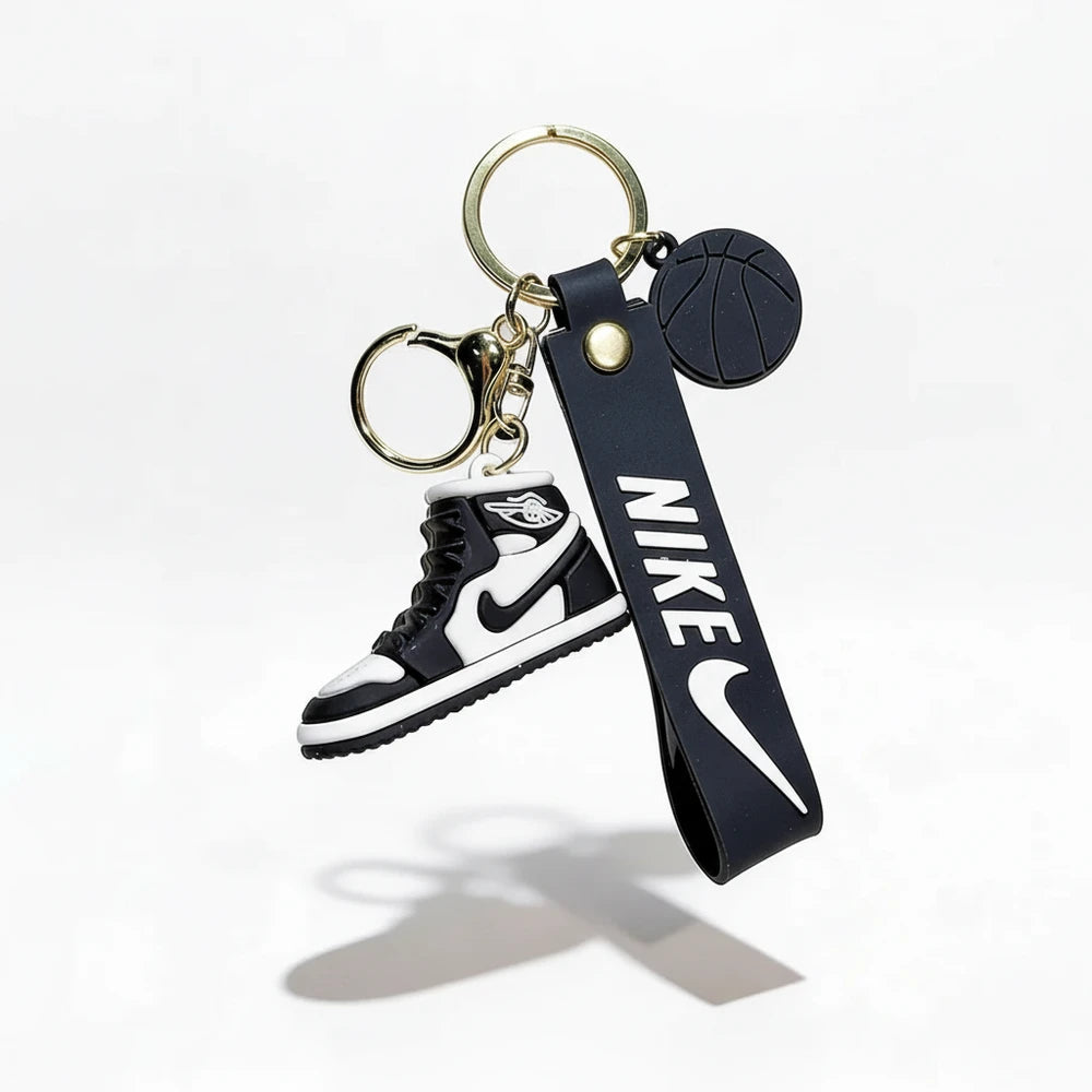 Keychain with Nike logo and shoe design on a white background