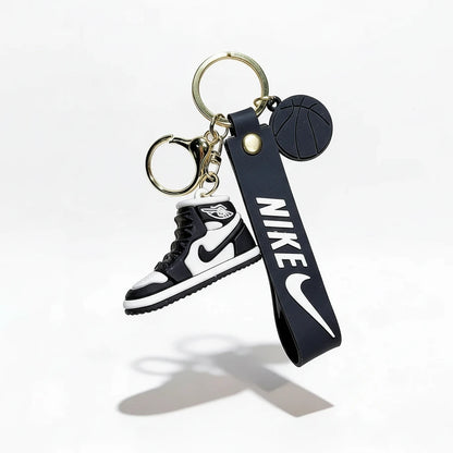 Keychain with Nike logo and shoe design on a white background