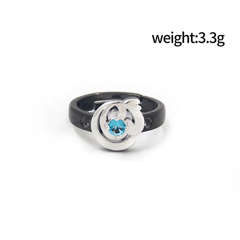 Ring with blue gemstone and black band on a white background, showing weight and diameter measurements.