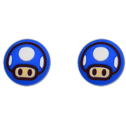 Pair of blue mushroom-shaped earrings on a white background