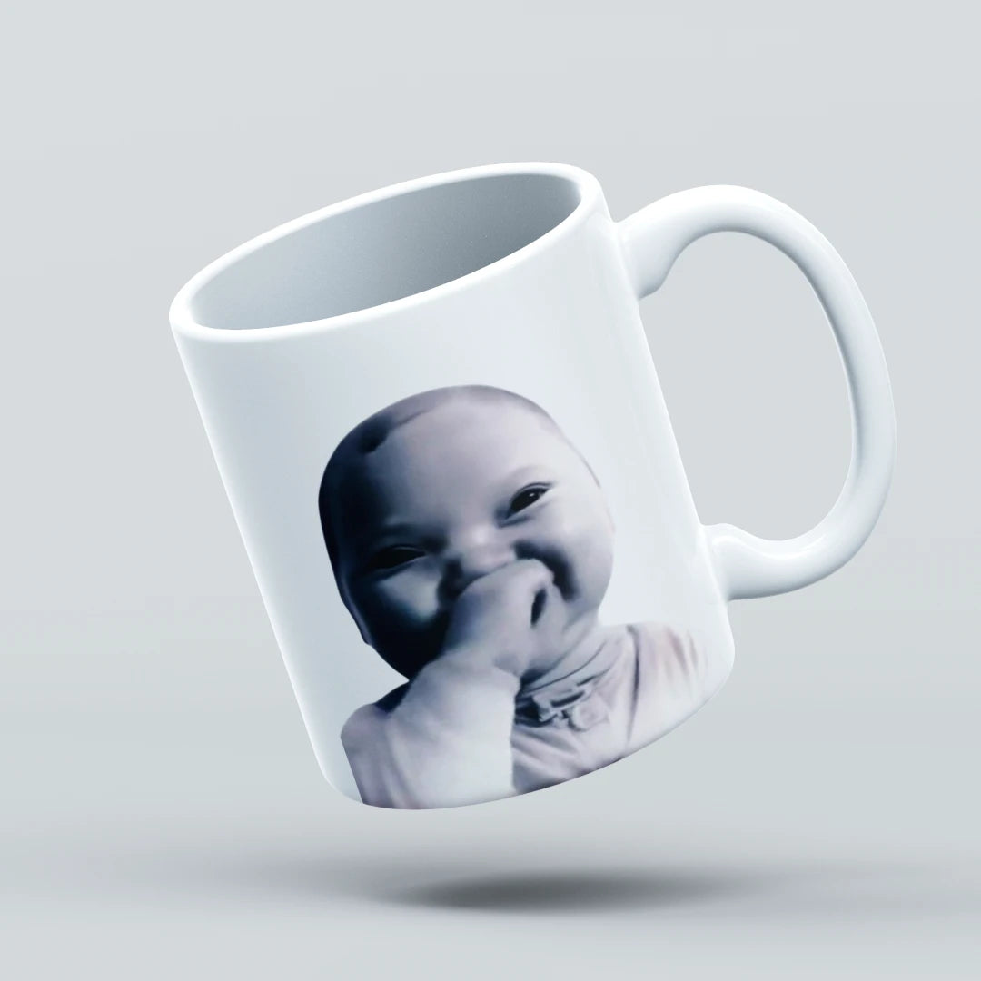 laughing baby  on a mug