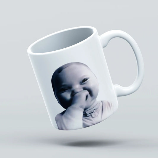 laughing baby  on a mug