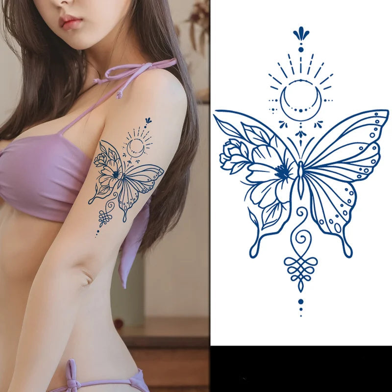 Woman with blue butterfly tattoo on arm next to tattoo design 