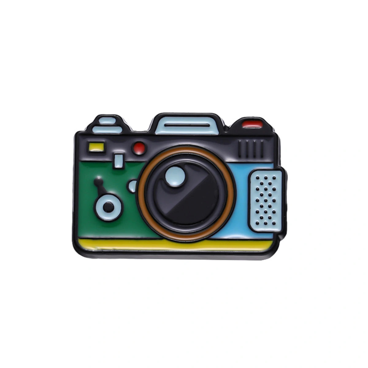 A colorful retro camera-shaped enamel pin on a plain white background. The pin features a green body, a blue side panel, a black lens and top section, a yellow stripe, and a silver perforated detail.