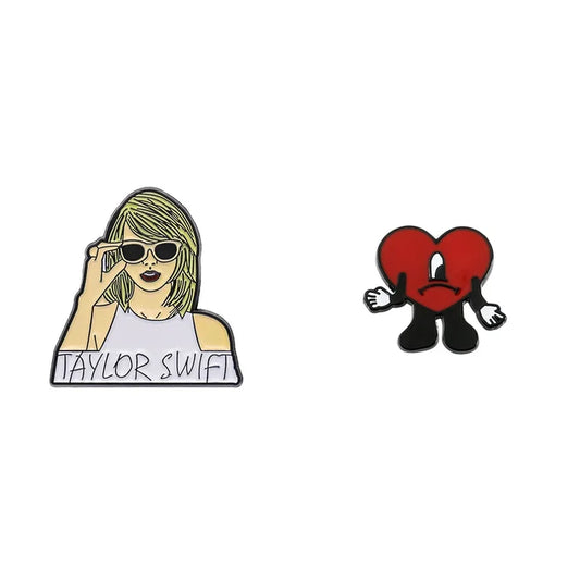 Two enamel pins on a white background, one featuring a person with sunglasses and the other a red heart character.