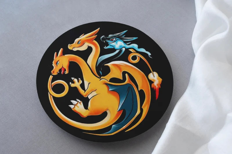 Circular coaster with a charizard pokemon design on a black background