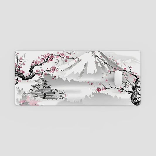 Desk mat with Mount Fuji, cherry blossoms, and a castle design on a white background