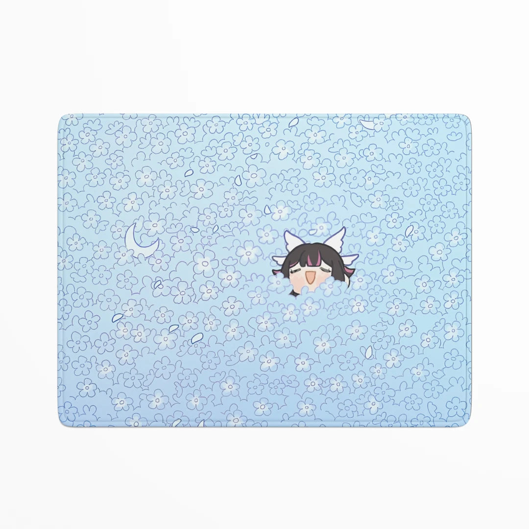 Light blue placemat with floral pattern and cartoon character on a white background