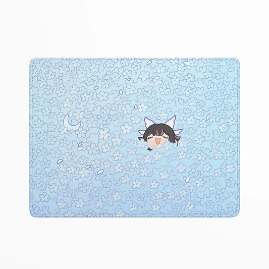 Light blue placemat with floral pattern and cartoon character on a white background