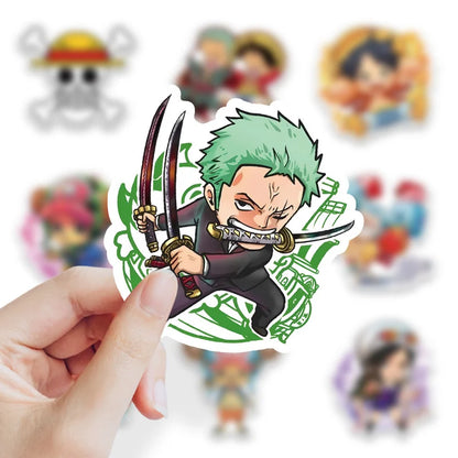 Hand holding a vinyl sticker of a character with green hair and a sword, with other colorful stickers in the background.