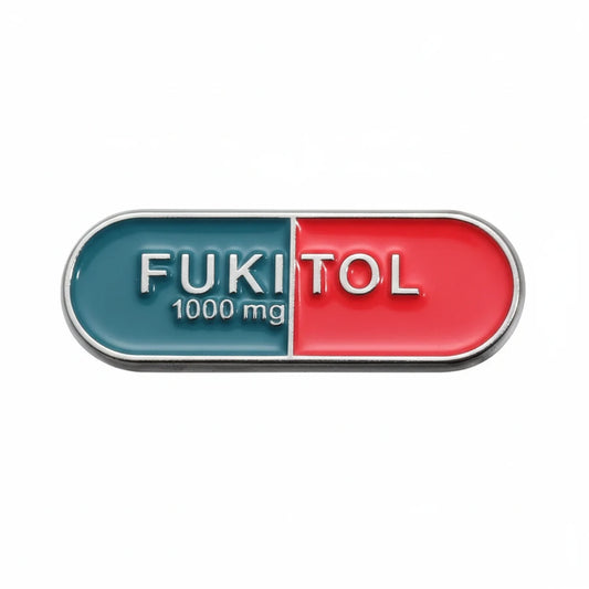 Double-sided pill with 'FUKITOL 1000 mg' text on a white background