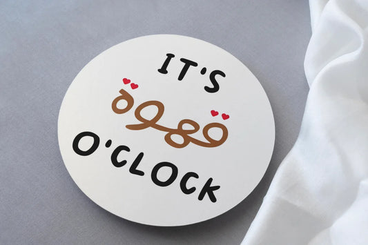 It's Coffee O'clock in Arabic print on circular mdf coaster