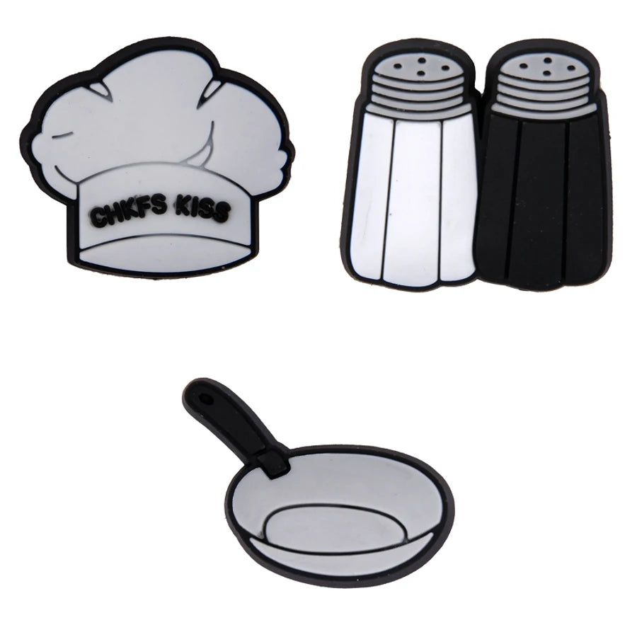 Set of kitchen-themed coasters including a chef's hat, salt and pepper shakers, and a frying pan on a white background.