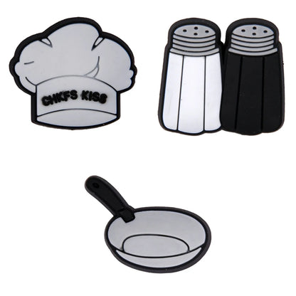 Set of kitchen-themed coasters including a chef's hat, salt and pepper shakers, and a frying pan on a white background.