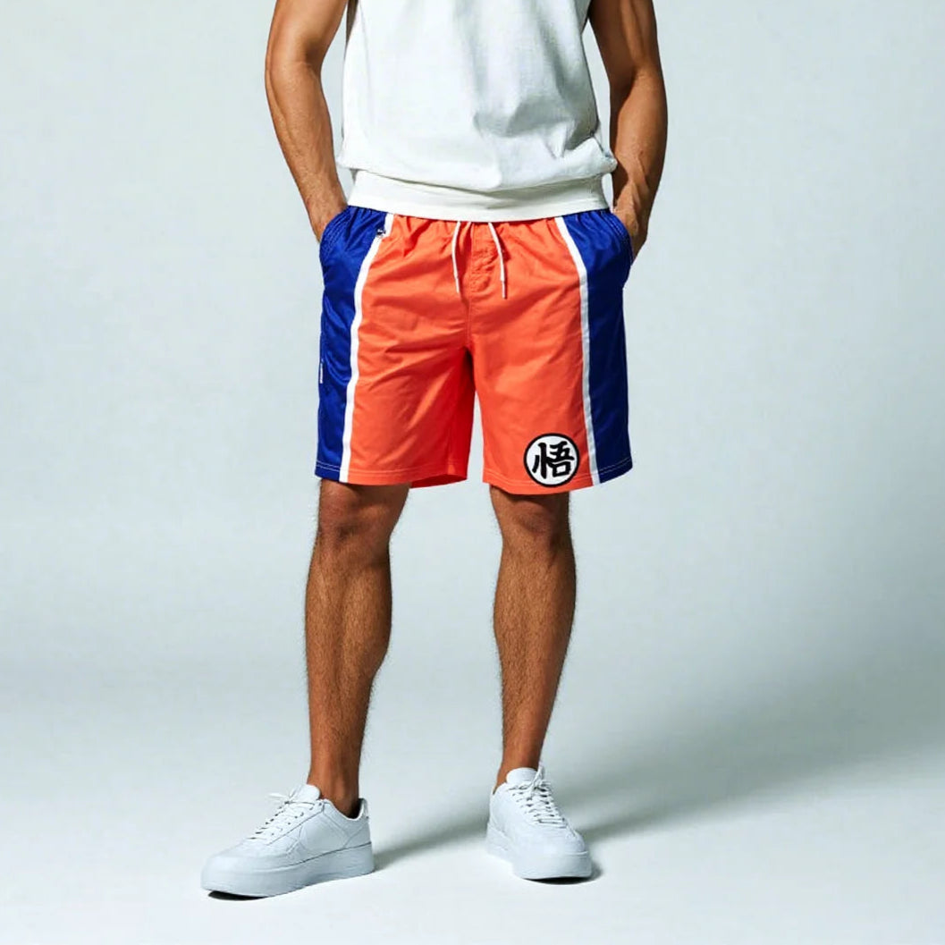 Man wearing a white tank top and red and blue shorts on a light gray background