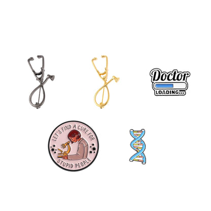 A set of five doctor-themed enamel pins on a plain white background, including two stethoscopes, a 'Doctor Loading.