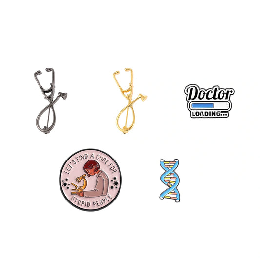 A set of five doctor-themed enamel pins on a plain white background, including two stethoscopes, a 'Doctor Loading.