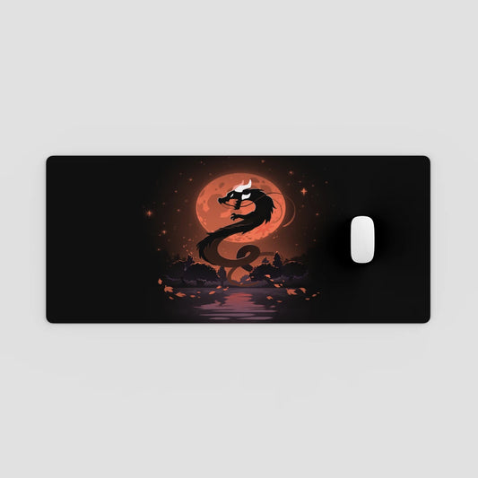 Dragon design on a black mouse pad with a red moon in the background