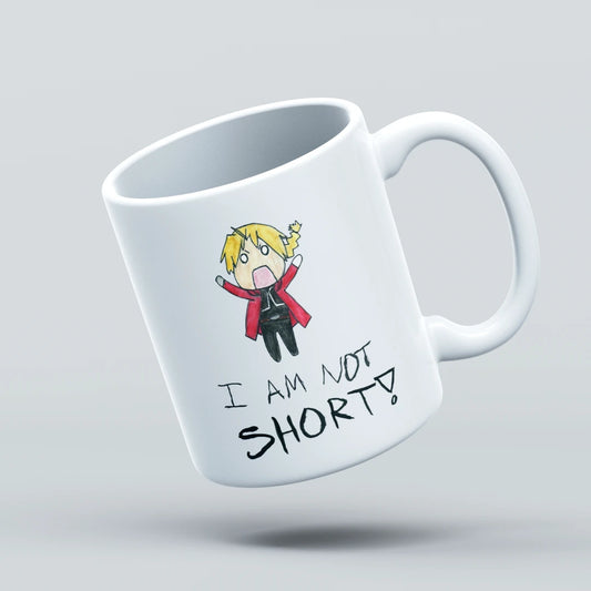 White mug with a cartoon character and text 'I AM NOT SHORT!' on a light gray background