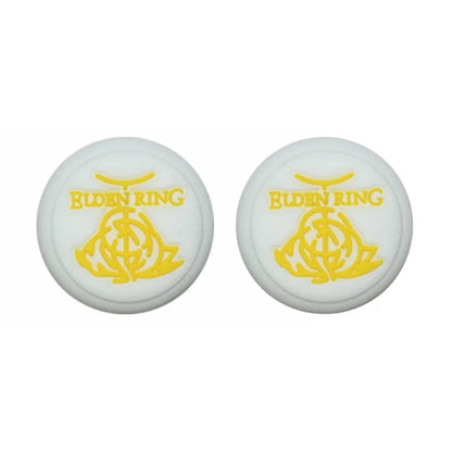 Two white circular objects with yellow 'Elden Ring' logo on a white background