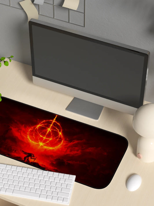 Desk setup with a computer monitor, keyboard, and mouse on a large decorative elden ring mouse pad.