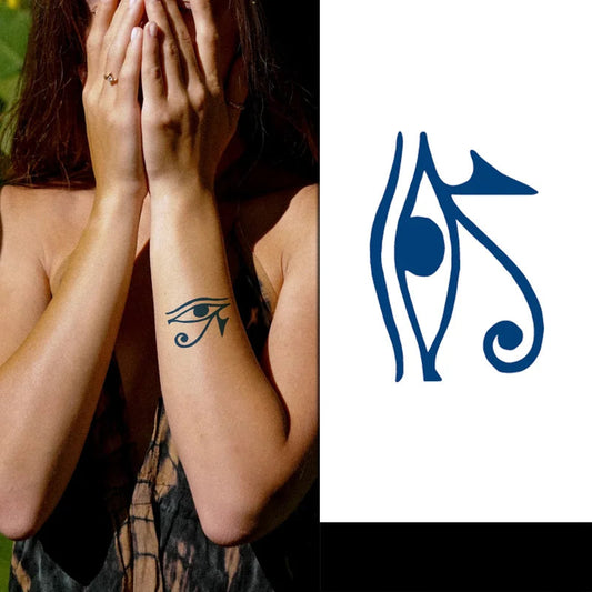 Person with an eye tattoo on their arm next to a blue hieroglyphic symbol