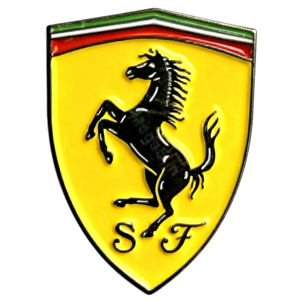 Ferrari logo with a black horse on a yellow shield with red and green stripes at the top