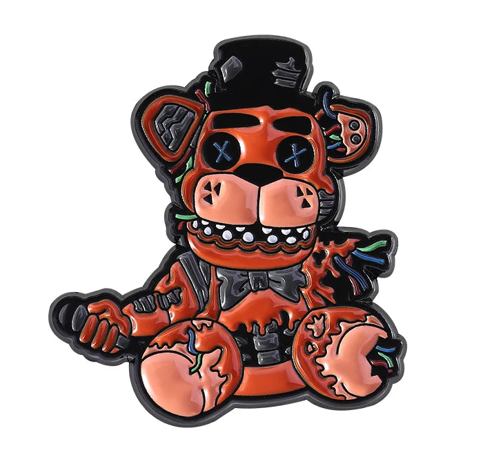 Halloween-themed teddy bear pin with orange and black colors on a white background
