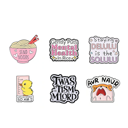 Six cartoon-style sticker or patch designs arranged on a plain white background. The designs include a pink noodle bowl with chopsticks, a text sticker reading 'Gently Putts Mental Health In Rice', a pink text sticker reading 'Staying DELULU is the SOLULU', a yellow duck with 'LIFE IS SUGAR SO AM I', black-and-white text reading 'TWAS THE TISM THE MIORD', and a pink character with orange hair and an open mouth.