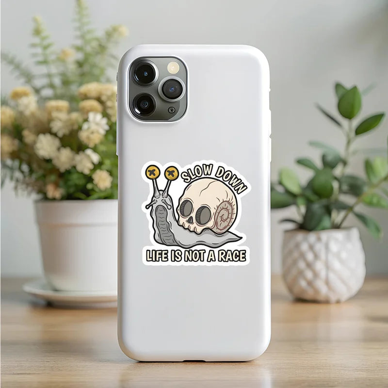 Phone case with a snail design and 'Slow down, life is not a race' text on a white background.