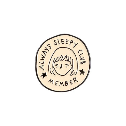 Circular badge with 'Always Sleepy Club Member' text and a sleeping face illustration on a white background.