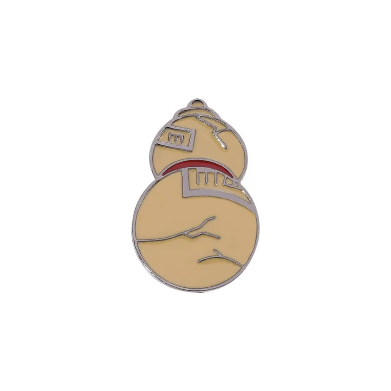 Pin with a design of a teabag and a face on a beige background