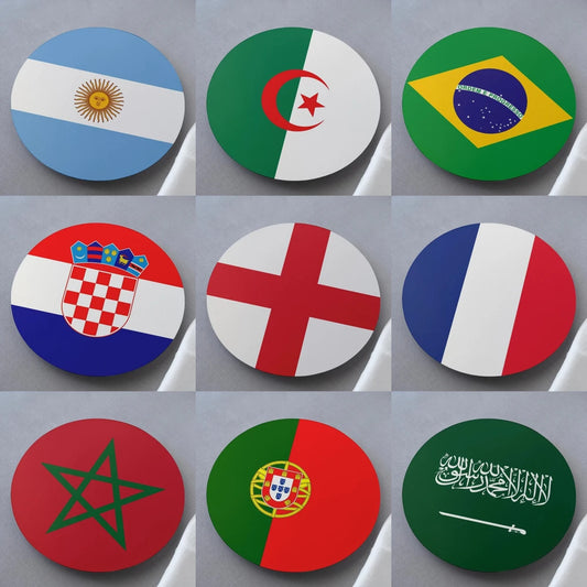 Collection of round flags from various countries on a gray background