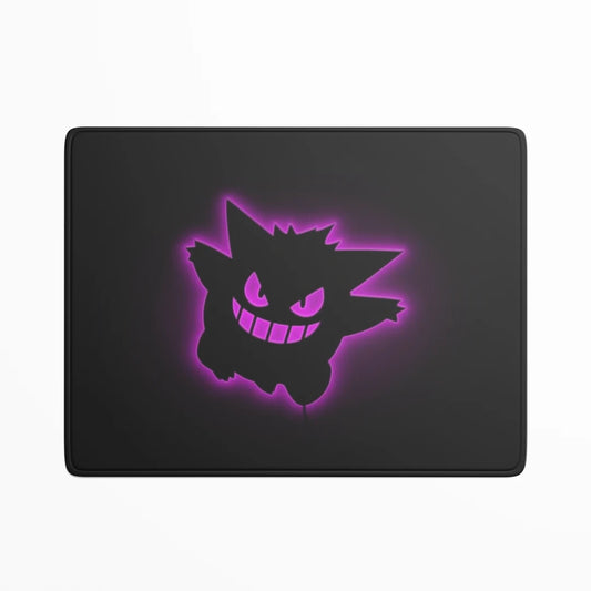 Black mouse pad with a glowing purple cartoon character design on a white background