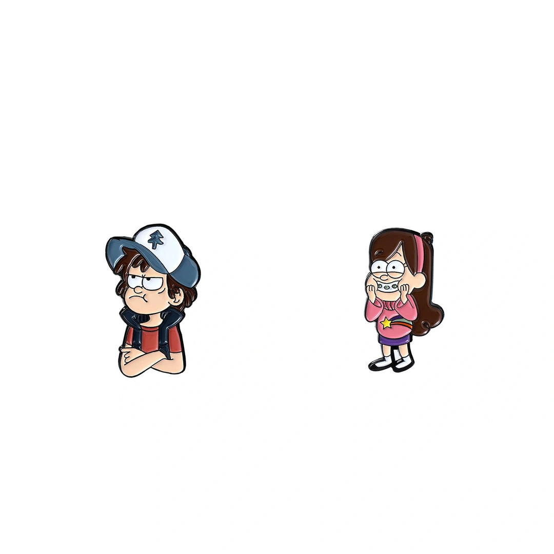 Two cartoon character enamel pins on a plain white background. The left pin shows a boy with glasses, a blue and white baseball cap, and a red shirt with dark suspenders, looking annoyed.
